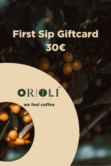 Orioli coffee gift card with coffee beans and leaves on a dark background