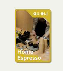 Orioli Home Espresso product packaging with a person preparing coffee.